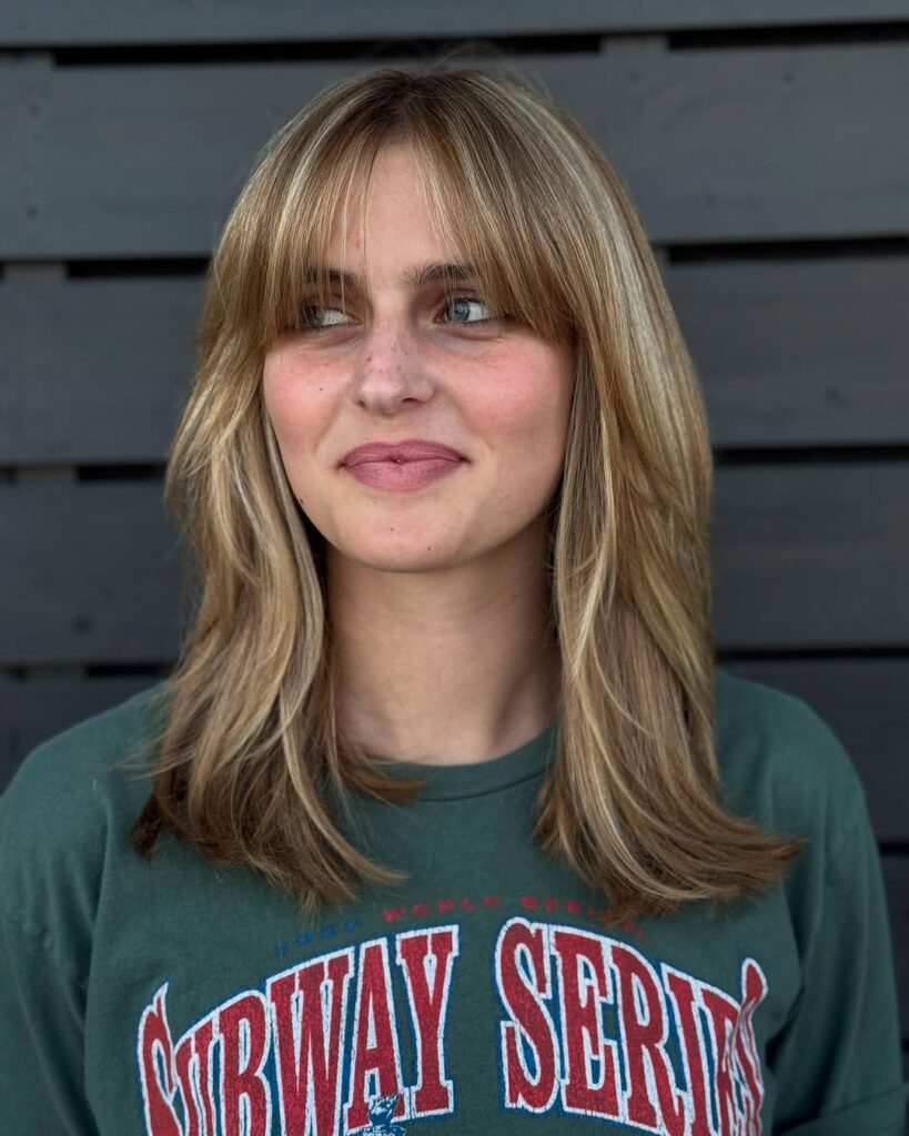 blonde haircut with layers and bangs